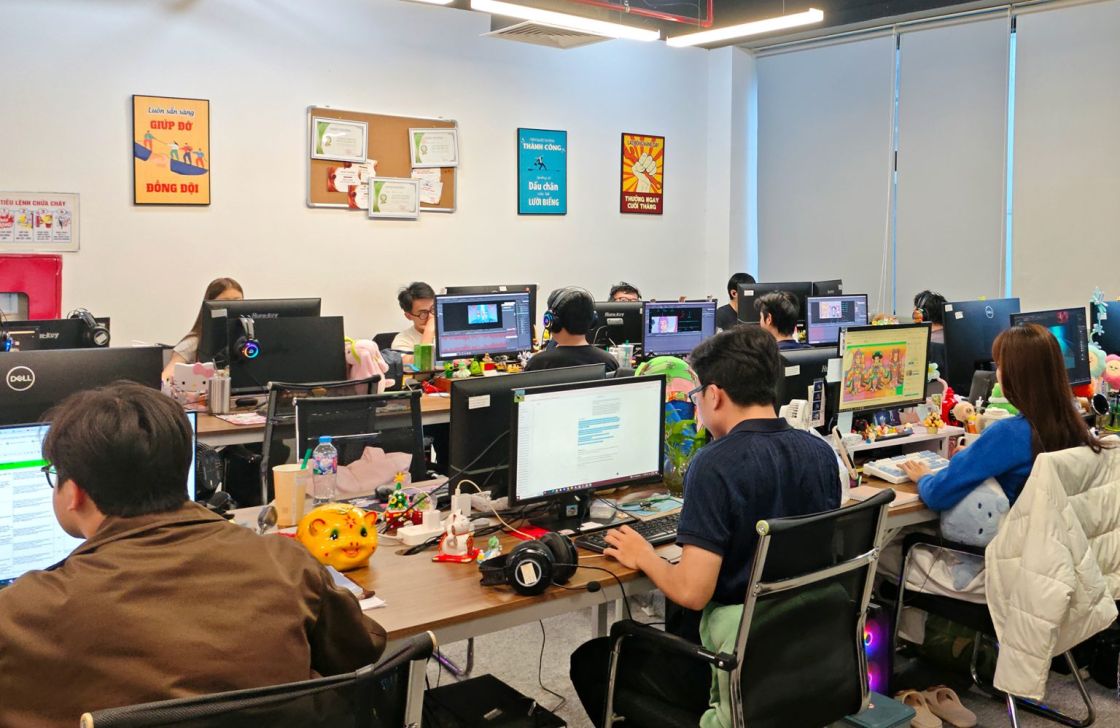 The 2D animation team at their desks in the MCNLINK LABS office